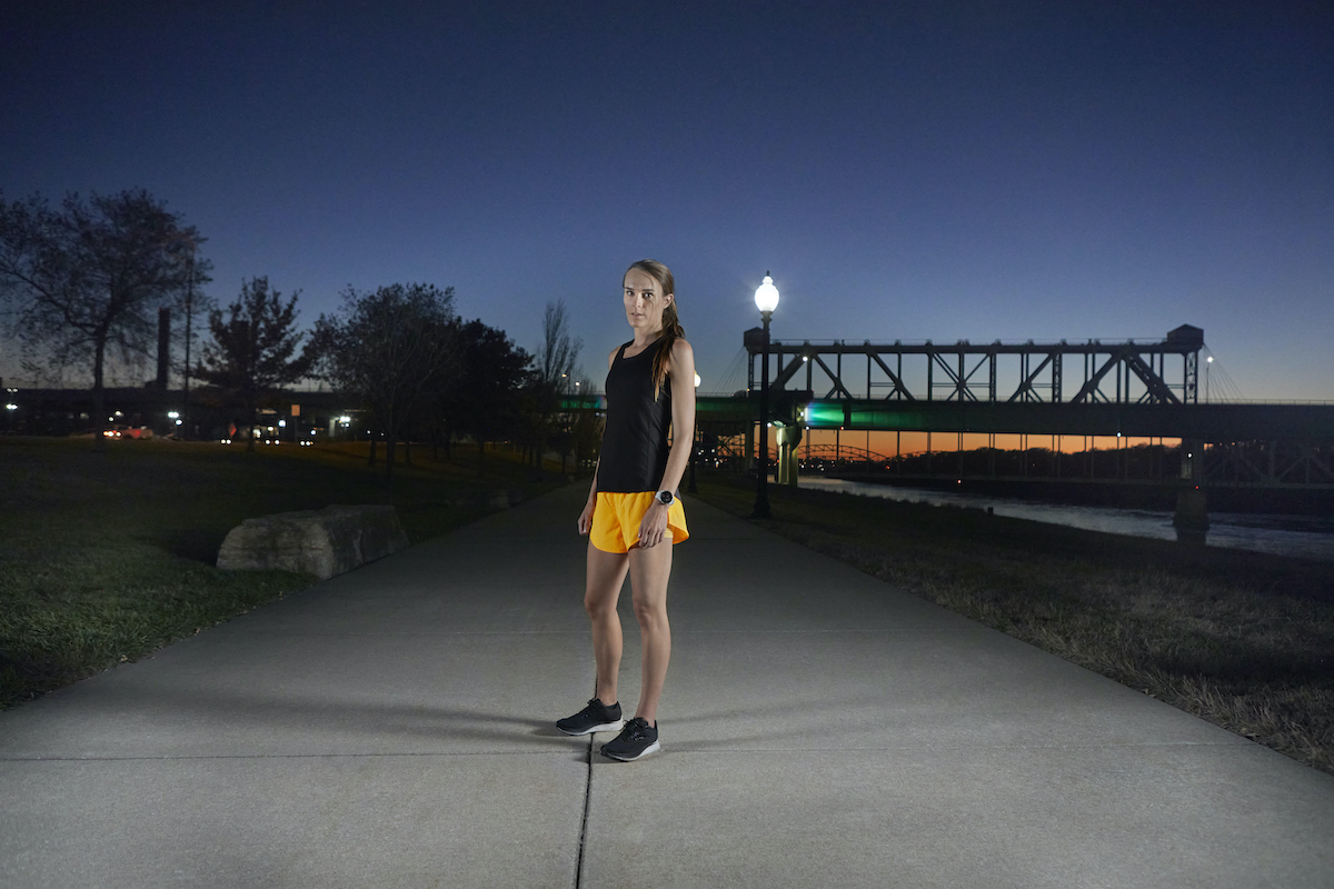 Woman wearing Forerunner 945 LTE smartwatch.